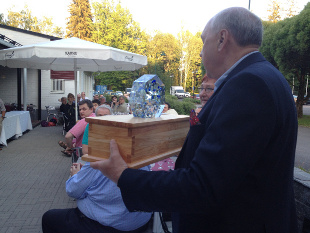 Mr. Finn Wardi presenting a new Challenge Cup